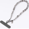 Uniq Coehl Candy Gem Handstrap uniwersalny sznurek do telefonu na reke srebrny/silver spar - (UNIQ-CANDYGEM-HSSILV)